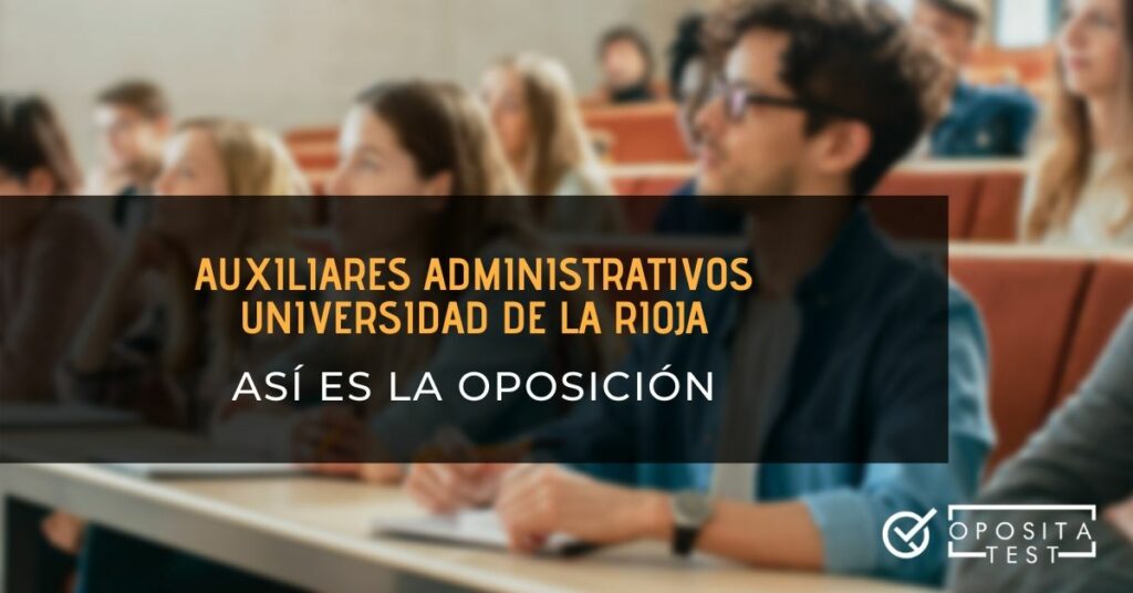 Personas en en un aula magna con bolígrafos y libretas  con el printer "auxiliares administrativos de la Universidad de La Rioja, así es la oposición"