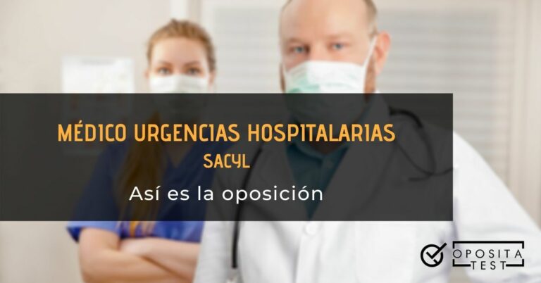 Médico en la parte derecha. Detrás de él, en la parte izquierda de la imagen, se sitúa una enfermera de pelo largo claro con los brazos cruzados. Toda la imagen está fuera de foco. Se utiliza para ilustrar una entrada sobre la oposición de Médico de Urgencias de SACYL.