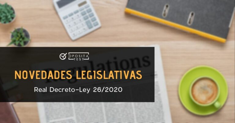 Imagen ilustrativa fuera de foco de una mesa con archivadores, calculadora, taza de café y prensa para acompañar un post que analiza el Real Decreto-ley 26/2020 y cómo afecta a las oposiciones