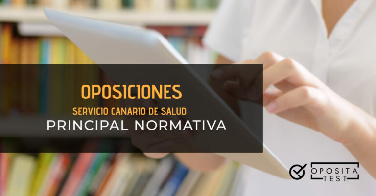Mujer con una bata blanca de manga corta leyendo algo en una tablet. Toda la imagen está fuera de foco. Se utiliza para ilustrar una entrada sobre las leyes de las oposiciones del Servicio Canario de Salud.