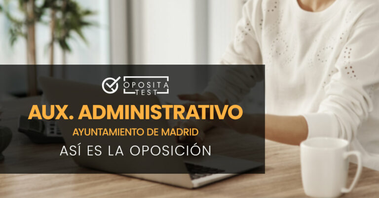 Mujer sentada tecleando en un ordenador portátil. Toda la imagen está fuera de foco. Se utiliza para ilustrar una entrada sobre cómo es la oposición de Auxiliar Administrativo del Ayuntamiento de Madrid.